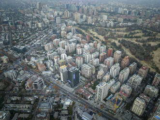 Aerial View Of Residential And Office Buildings During Smoggy Day In Downtown Santiago, Chile. - AAEF21897