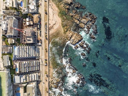 Aerial Top Down View Of Modern Luxury Seaside Apartment Buildings And Ocean Rocks At Playa Cochoa Beach In Valparaiso, Chile. - AAEF21899