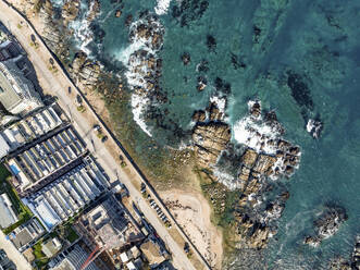 Aerial Top Down View Of Modern Luxury Seaside Apartment Buildings And Ocean Rocks At Playa Cochoa Beach In Valparaiso, Chile. - AAEF21900