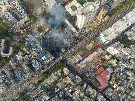 Aerial view of Firefighters and mass people were working to douse the massive fire in the capital city Dhaka, Bangladesh. - AAEF21963