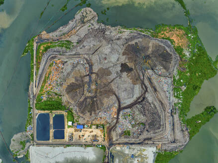 Aerial view of cranes working at the largest waste dumping yard in Aminbazar, Dhaka, Bangladesh. - AAEF22012