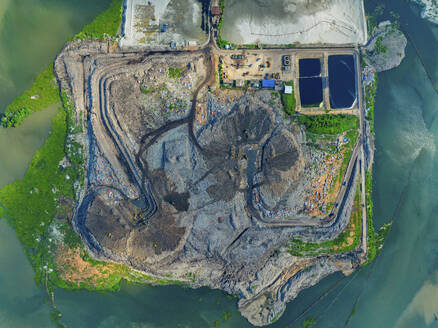 Aerial view of cranes working at the largest waste dumping yard in Aminbazar, Dhaka, Bangladesh. - AAEF22016