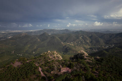 Aerial view of a majestic mountain range with cloudy cinematic sky and lighting, Mirador de Garbi, Estivella, Valencia, Spain. - AAEF22083