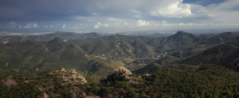 Panoramic view of a majestic mountain range with cloudy cinematic sky and lighting, Mirador de Garbi, Estivella, Valencia, Spain. - AAEF22084