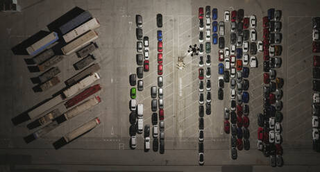 Aerial view of a big parking area with camions and cars at night in Grao, Valencia, Spain, Grao, Valencia, Spain. - AAEF22107