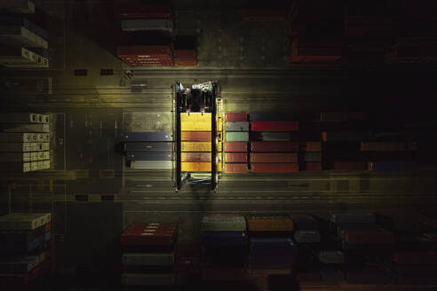 Aerial view of containers at night in the harbor area Grao, Valencia, Spain. - AAEF22109