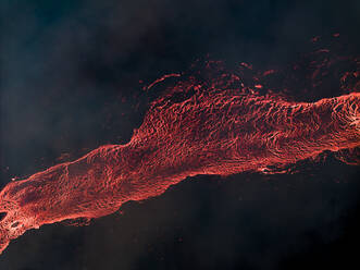 Aerial view of lava flowing from Litli-Hrutur (Little Ram) Volcano during an eruption on Fagradalsfjall volcanic area in southwest Iceland at night, it's a fissure eruption started on the Reykjanes Peninsula, Iceland. - AAEF22225