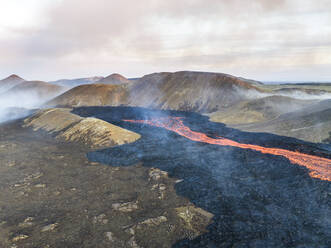 Aerial view of Litli-Hrutur (Little Ram) Volcano during an eruption on Fagradalsfjall volcanic area in southwest Iceland, it's a fissure eruption started on the Reykjanes Peninsula, Iceland. - AAEF22239