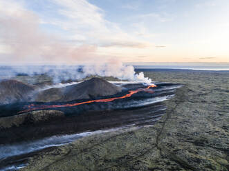 Aerial view of Litli-Hrutur (Little Ram) Volcano during an eruption on Fagradalsfjall volcanic area in southwest Iceland, it's a fissure eruption started on the Reykjanes Peninsula, Iceland. - AAEF22240