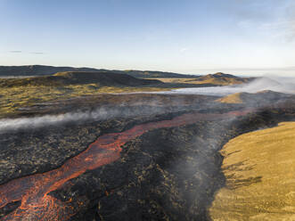 Aerial view of Litli-Hrutur (Little Ram) Volcano during an eruption on Fagradalsfjall volcanic area in southwest Iceland, it's a fissure eruption started on the Reykjanes Peninsula, Iceland. - AAEF22282