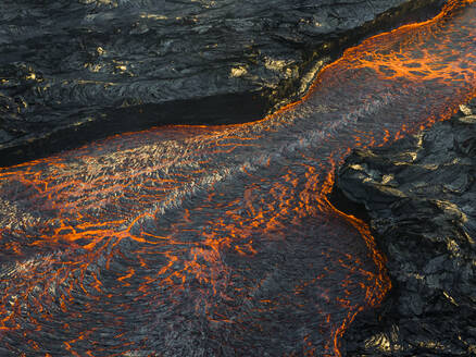 Aerial view of the magma flowing from the Litli-Hrutur (Little Ram) Volcano during an eruption on Fagradalsfjall volcanic area in southwest Iceland, Iceland. - AAEF22288