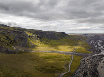 Aerial view of a road following the river across the valley in Hvolsvollur, Southern Region of Iceland. - AAEF22295