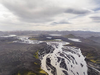 Aerial view of a river crossing a valley with lakes in Hella region, Southern Region, Iceland. - AAEF22334