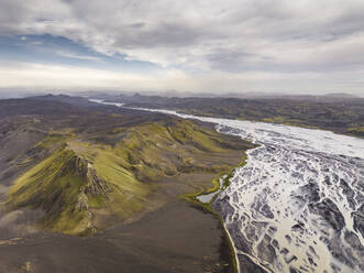 Aerial view of a beautiful mountain landscape in the highlands with a river crossing the canyon, Hella, Southern Region, Iceland. - AAEF22340