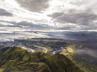 Aerial view of a mountain landscape with river streaming across the valley in the highlands of Iceland, Kirkjubaejarklaustur, Southern Region, Iceland. - AAEF22358
