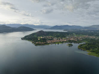 Aerial view of Angera, a small town along Lago Maggiore (Lake Maggiore) at sunset, Lombardy, Italy. - AAEF22485