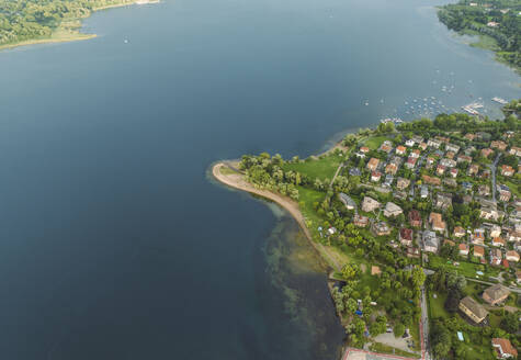 Aerial view of Arona residential area along the Lago Maggiore (Lake Maggiore) at sunset, Novara, Piedmont, Italy. - AAEF22490