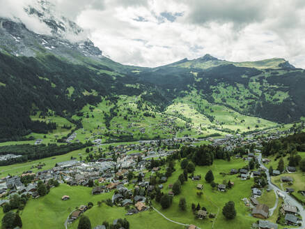 Aerial view of Grindelwald, a small town in the valley on the Swiss Alps, Canton of Bern, Switzerland. - AAEF22507
