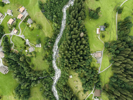 Aerial view of Schwarze Lutschine river in Grindelwald town, Bern, Switzerland. - AAEF22512