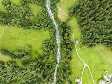 Aerial view of Schwarze Lutschine river in Grindelwald town, Bern, Switzerland. - AAEF22515