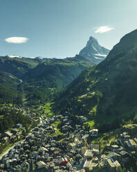 Aerial view of the Matterhorn, an iconic mountain peak with Zermatt town on foreground, Swiss Alps in summertime, Valais, Switzerland. - AAEF22638