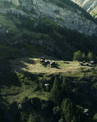 Aerial view of mountain wooden houses on the mountain slopes in Zermatt, Swiss Alps, Valais, Switzerland. - AAEF22641