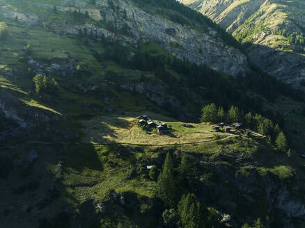 Aerial view of mountain wooden houses on the mountain slopes in Zermatt, Swiss Alps, Valais, Switzerland. - AAEF22642