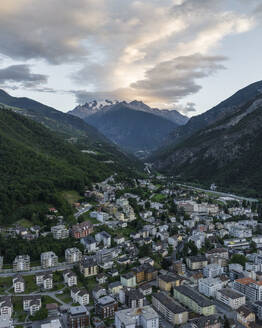 Aerial view of Visp residential district, a small town among the Swiss Alps mountains at sunset, Valais, Switzerland. - AAEF22645