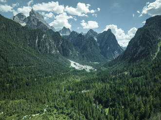 Aerial view of Tre Cime Natural Park (Drei Zinnen) seen from Dobbiaco Lake on the Dolomites mountain range, Toblach, Trentino, South Tyrol, Italy. - AAEF22690