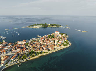 Aerial view of Porec and Otocic Sveti Nikola, a small island, a small town along the Adriatic Sea coastline in Istria, Croatia. - AAEF22796