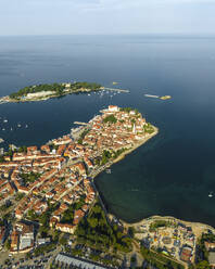 Aerial view of Porec at sunrise, a small town along the Adriatic Sea coastline in Istria, Croatia. - AAEF22801