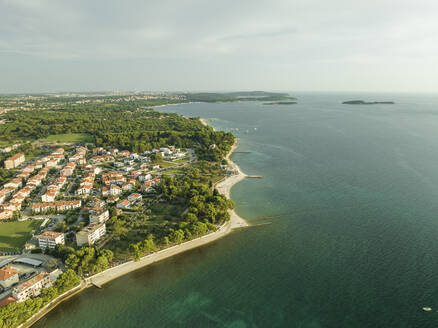 Aerial view of the Adriatic Sea coastline at sunset near Pula, Istria, Croatia. - AAEF22837