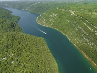 Aerial view of boats sailing along the Limski Fjord (Canal di Leme) in Sveti Lovrec, Istria, Croatia. - AAEF22843