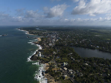 Aerial view of the beach, sea and lagoon in Hikkaduwa, Sri Lanka. - AAEF22880