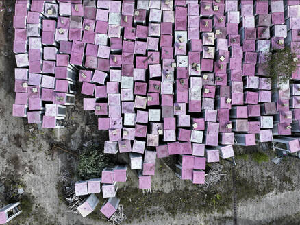 Aerial view of a phone box graveyard, a storage and dismantling facility for old phone boxes in Brandenburg, Germany. - AAEF22933