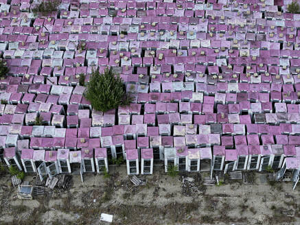 Aerial view of a phone box graveyard, a storage and dismantling facility for old phone boxes in Brandenburg, Germany. - AAEF22934