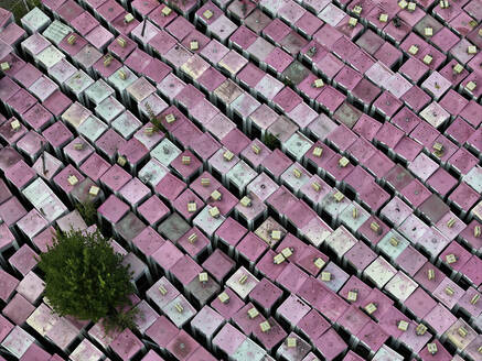 Aerial view of a phone box graveyard, a storage and dismantling facility for old phone boxes in Brandenburg, Germany. - AAEF22937