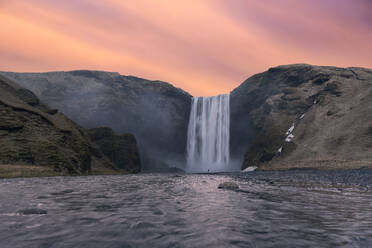 Spectacular scenery of large waterfall with clean water at sunset - ADSF47635