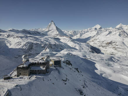 Panoramic view of from gornergrat train in switzerland and ski resort mountains in haze and sunlight - ADSF47775