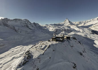 Panoramic view of from gornergrat train in switzerland and ski resort mountains in haze and sunlight - ADSF47776