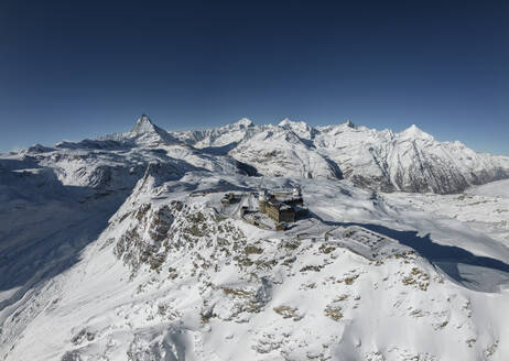 Panoramic view of from gornergrat train in switzerland and ski resort mountains in haze and sunlight - ADSF47778