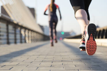 Close-up of woman running with unfocused background - INGF12713