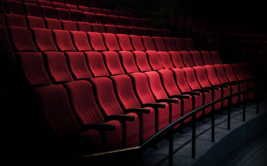 Rows of red seats in a theater - INGF12714