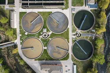 Aerial top view of round polls in wastewater treatment plant, filtration of dirty or sewage water. High quality photo. Aerial top view of round polls in wastewater treatment plant, filtration of dirty or sewage water. - INGF12838