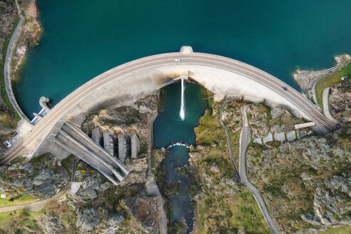 Aerial drone footage top view Water dam and reservoir lake, generating hydro electricity power renewable energy and sustainable development. High quality photo.. Aerial drone footage top view Water dam and reservoir lake, generating hydro electricity power renewable energy and sustainable development. High quality photo - INGF12839