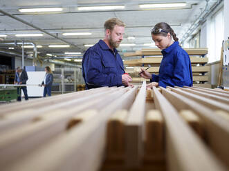 Carpenter teaching trainee in factory - CVF02534