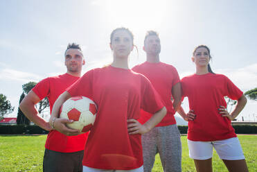 Football players training in soccer field, concepts about teamwork and sport - DMDF05539