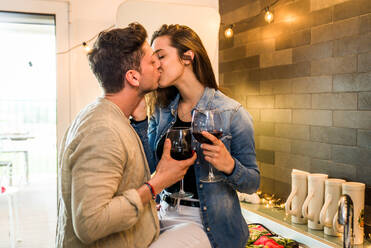Beautiful young couple of lovers drinking wine at home - DMDF05563