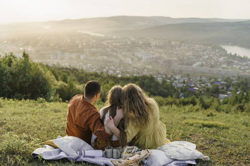 Family spending leisure time in meadow - VBUF00393