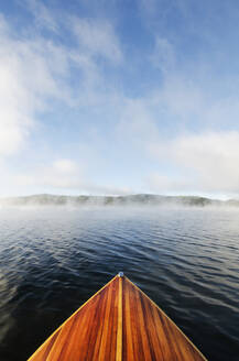 Boat on Lake Placid in morning mist - TETF02260